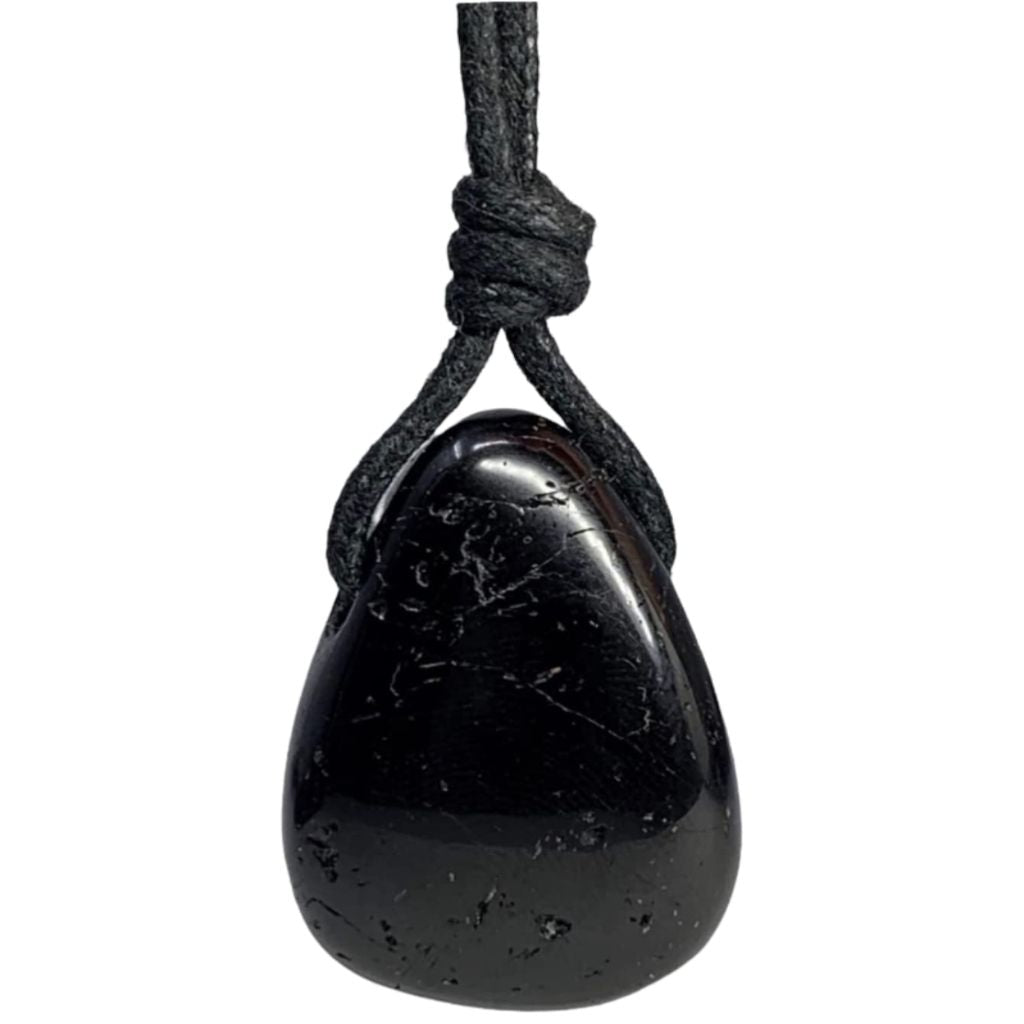 A black tourmaline pendant attached to a black cord, viewed from above the pendant.