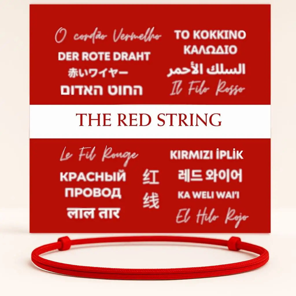 Red string bracelet with text in multiple languages on a red background