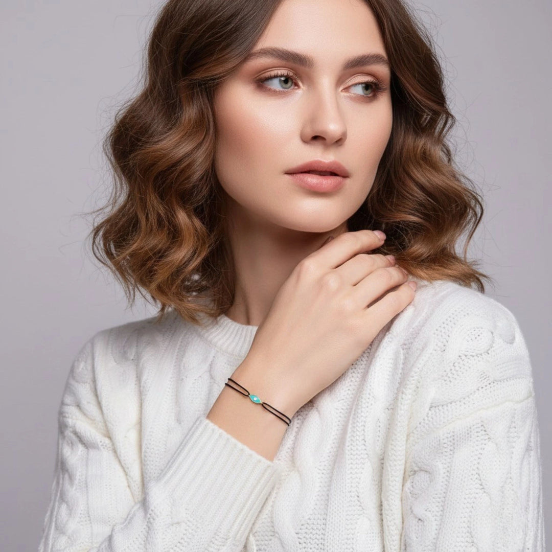 Woman wearing a white sweater with a gray background