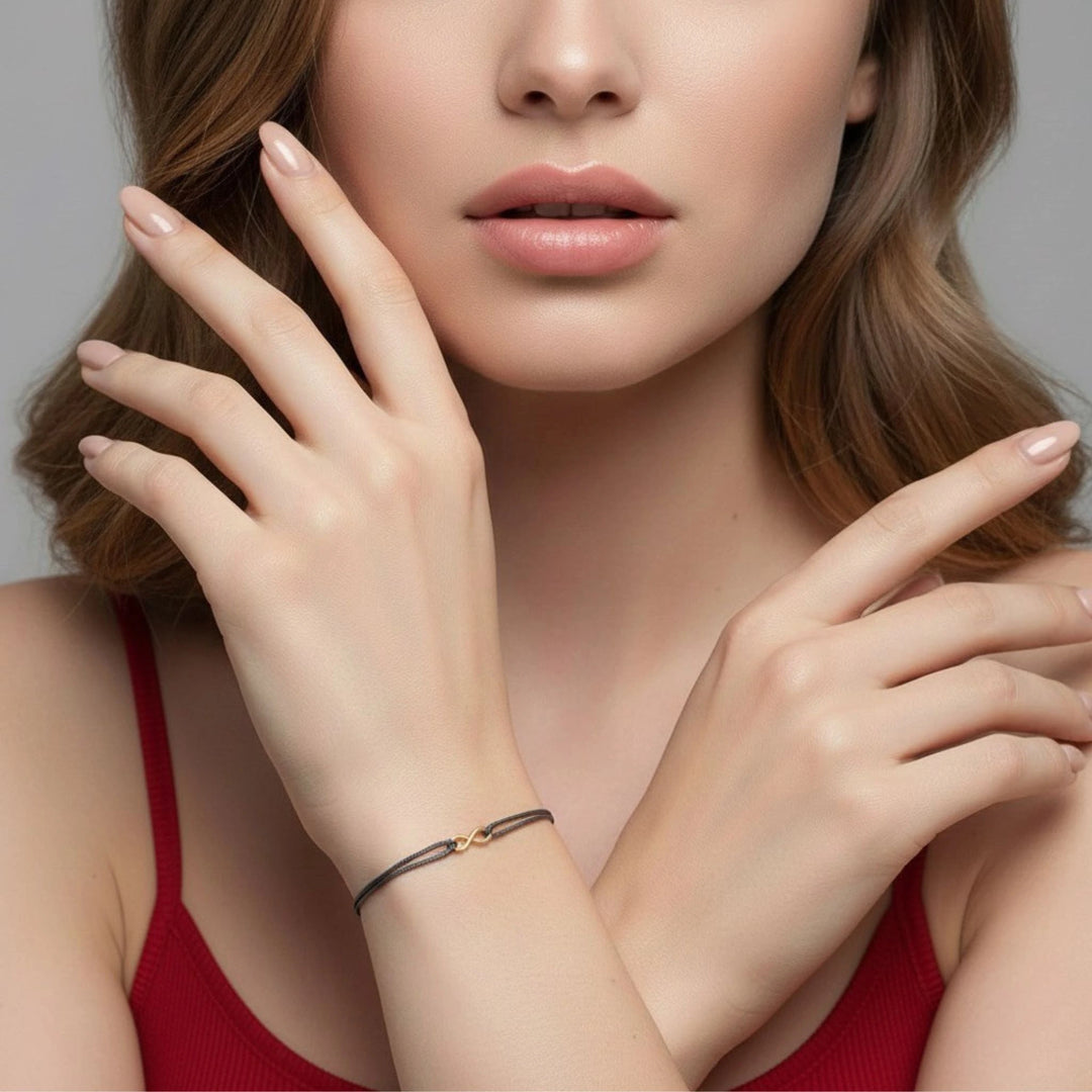 Close-up of a woman's face and hands with a neutral background