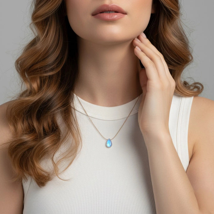 Rainbow moonstone pendant necklace on woman
