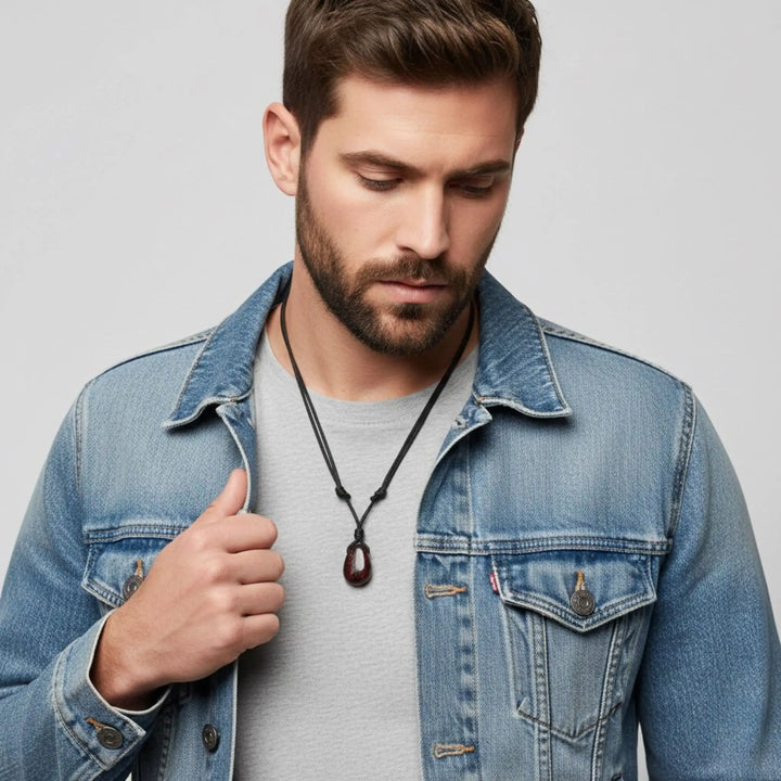 Man wearing a denim jacket with a gray background