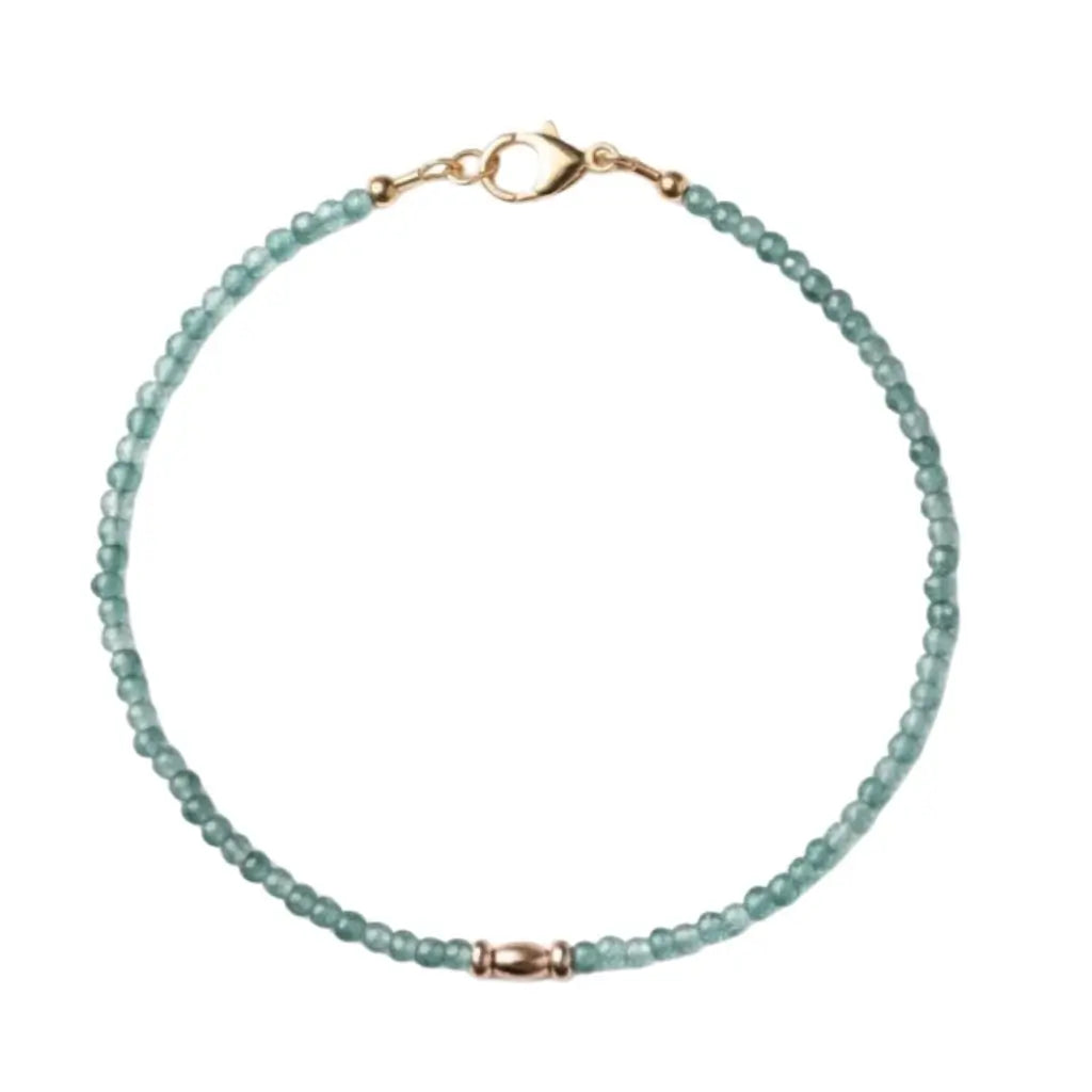 Beaded paraiba tourmaline bracelet with gold clasp on a white background