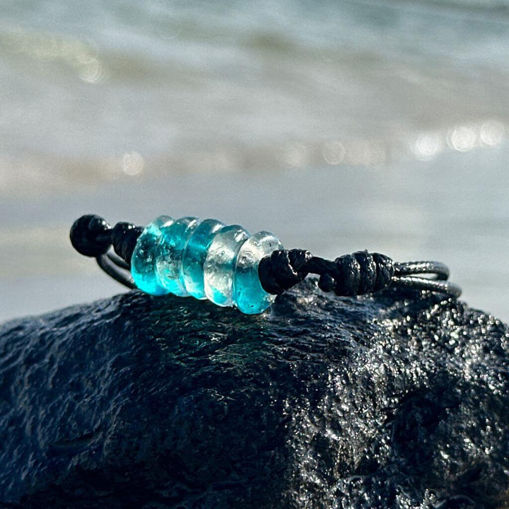recycled glass bracelet on beach landscape