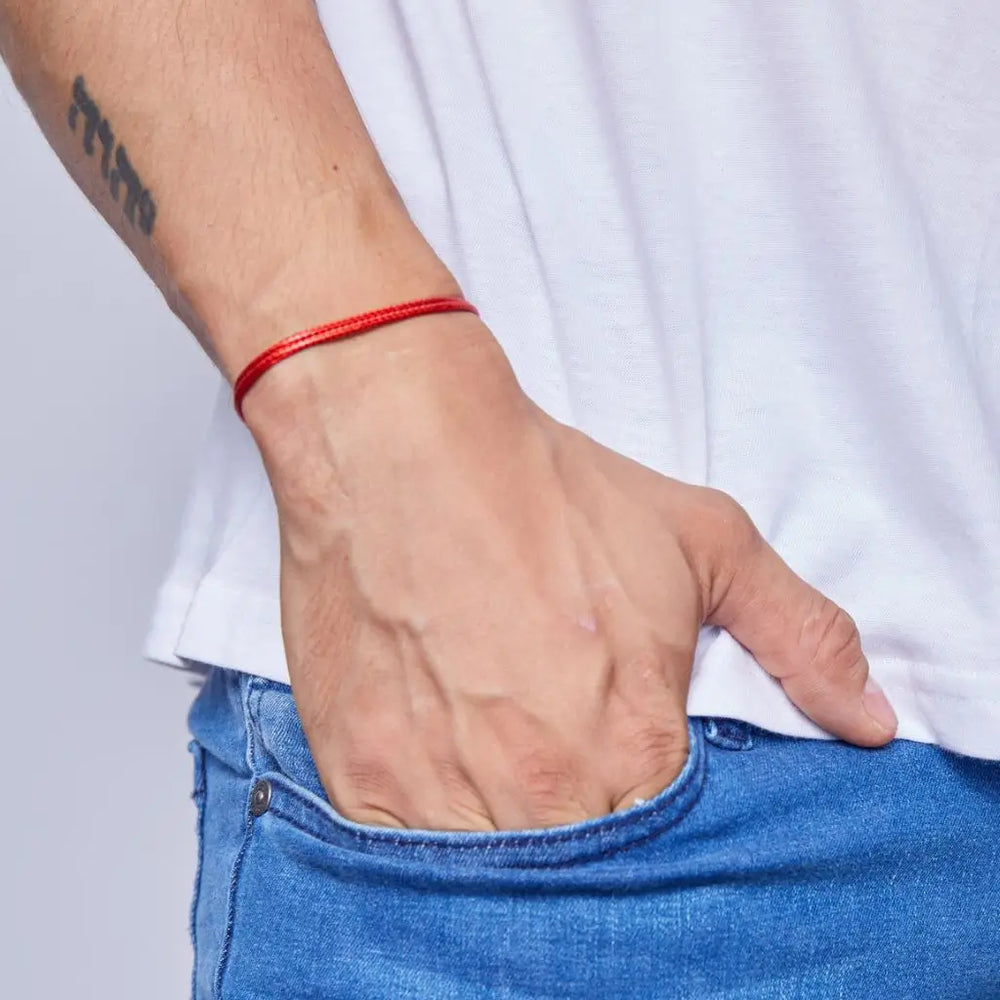 Man wearing the Red String Bracelet - Adjustable and durable for symbol of protection and good luck.