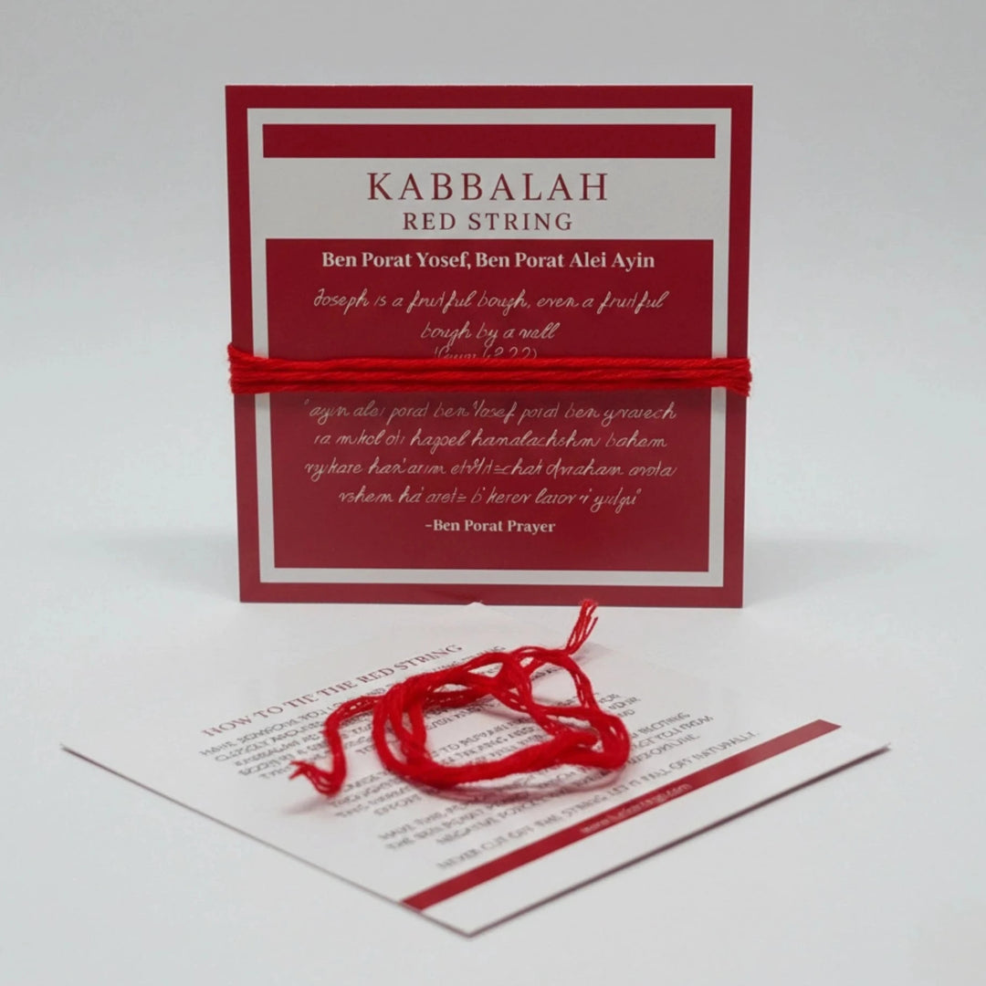 Kabbalah red string with a card on a white background