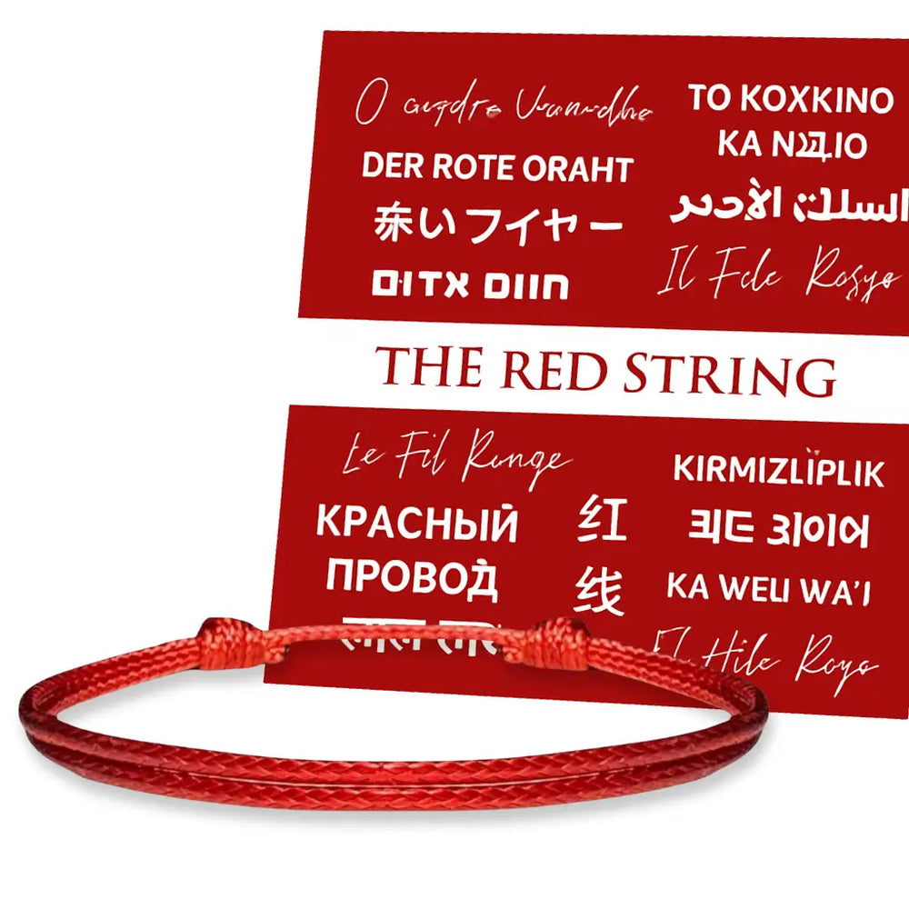 Red string bracelet with text labels in various languages 