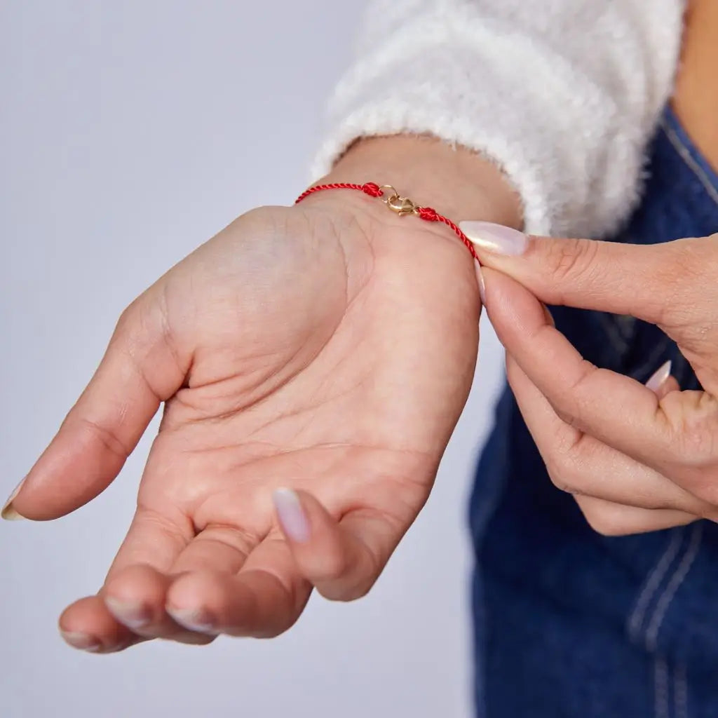 Silky Nylon Red String Bracelet in red and black on female wrist - Luck Strings