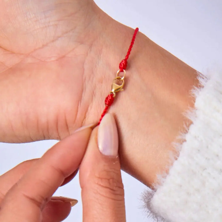 Silky Nylon Red String Bracelet in red and black on female wrist - Luck Strings