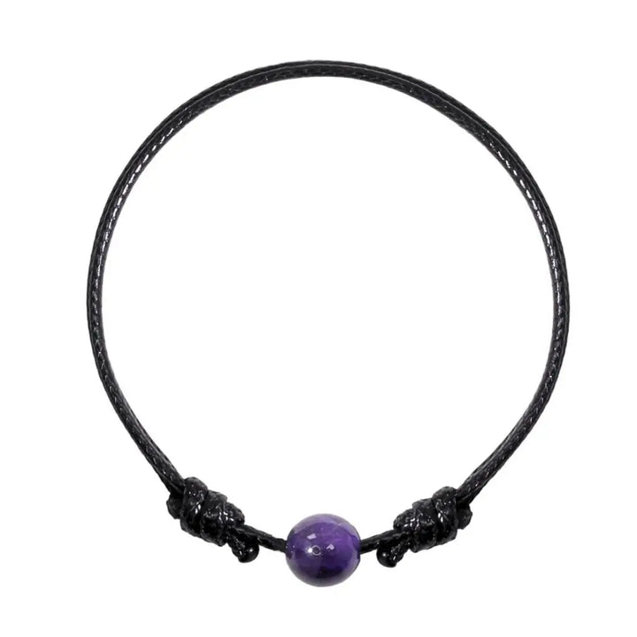 Smooth amethyst single bead bracelet on black waxed nylon cord, isolated product view.
