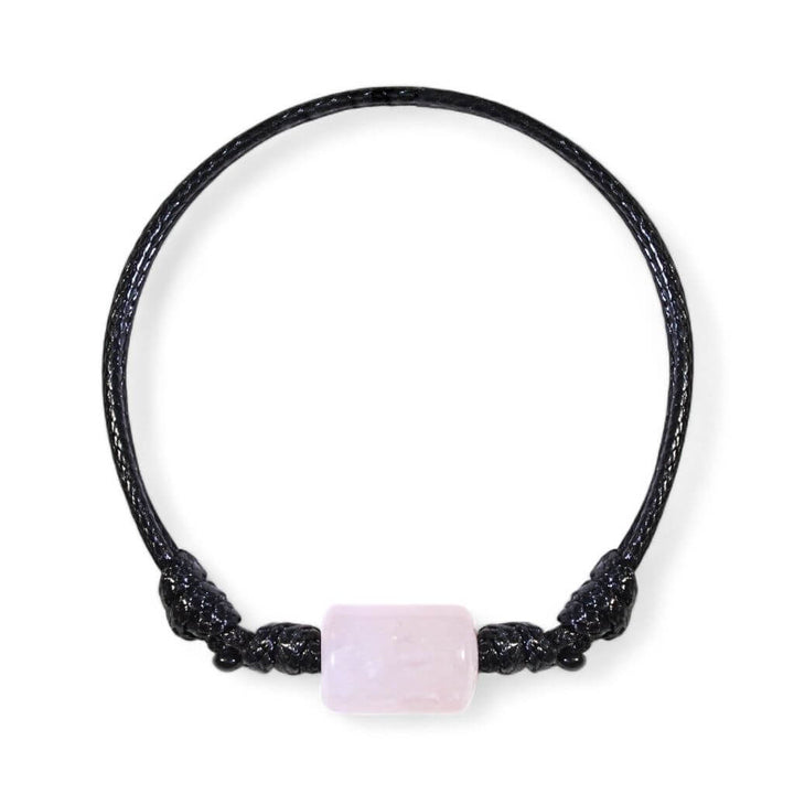 Smooth rose quartz cylinder bead bracelet on black waxed nylon cord.