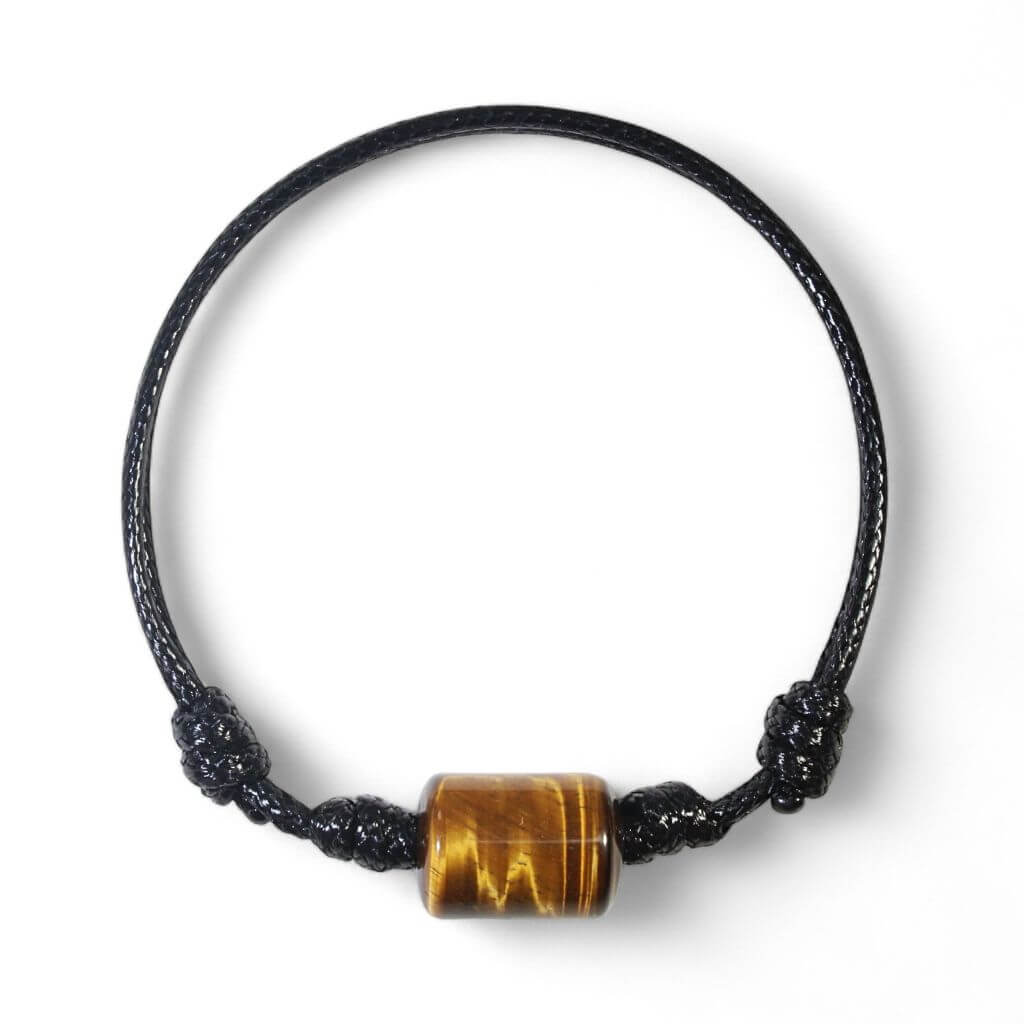 Smooth tiger’s eye cylinder bead bracelet on black waxed nylon cord.