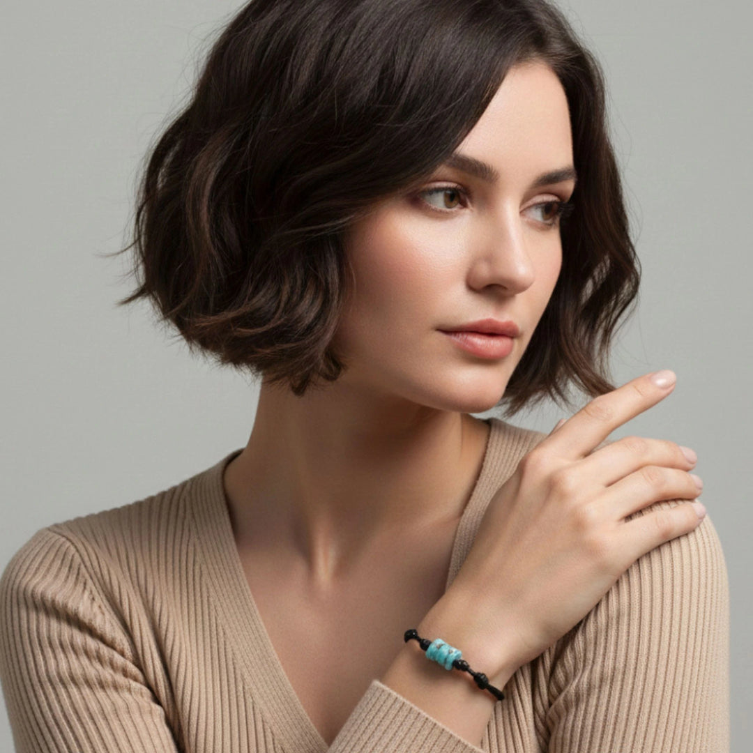 Woman wearing adjustable turquoise bone bead bracelet on black cord