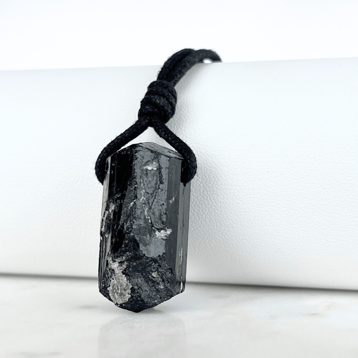 One-of-a-Kind Raw Black Tourmaline Pendant - A unique symbol of protection and individuality by Luck Strings.
