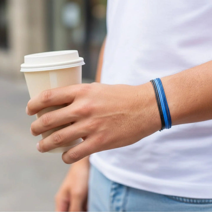Person holding a coffee cup with a blurred background
