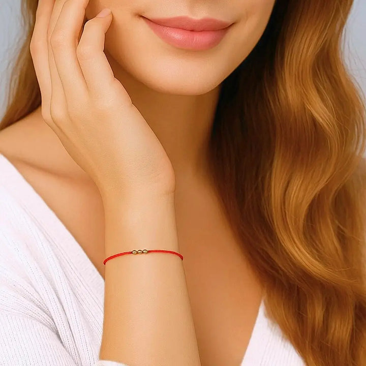 Woman Wearing Solid Gold Red String Bracelet Handmade by Luck Strings