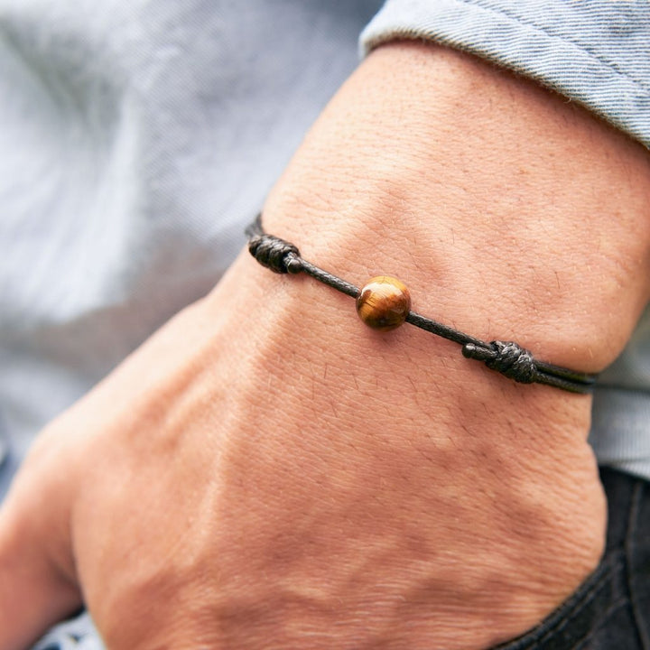 Close-up of tiger’s eye bead bracelet with adjustable waxed nylon cord